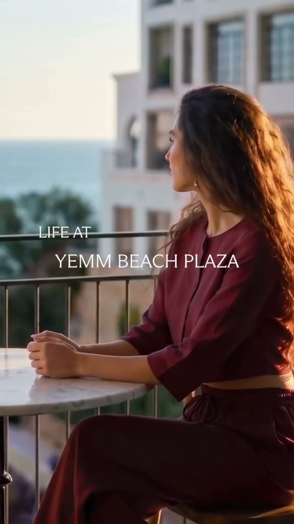 Complete source frame with the printed caption Life at Yemm Beach Plaza